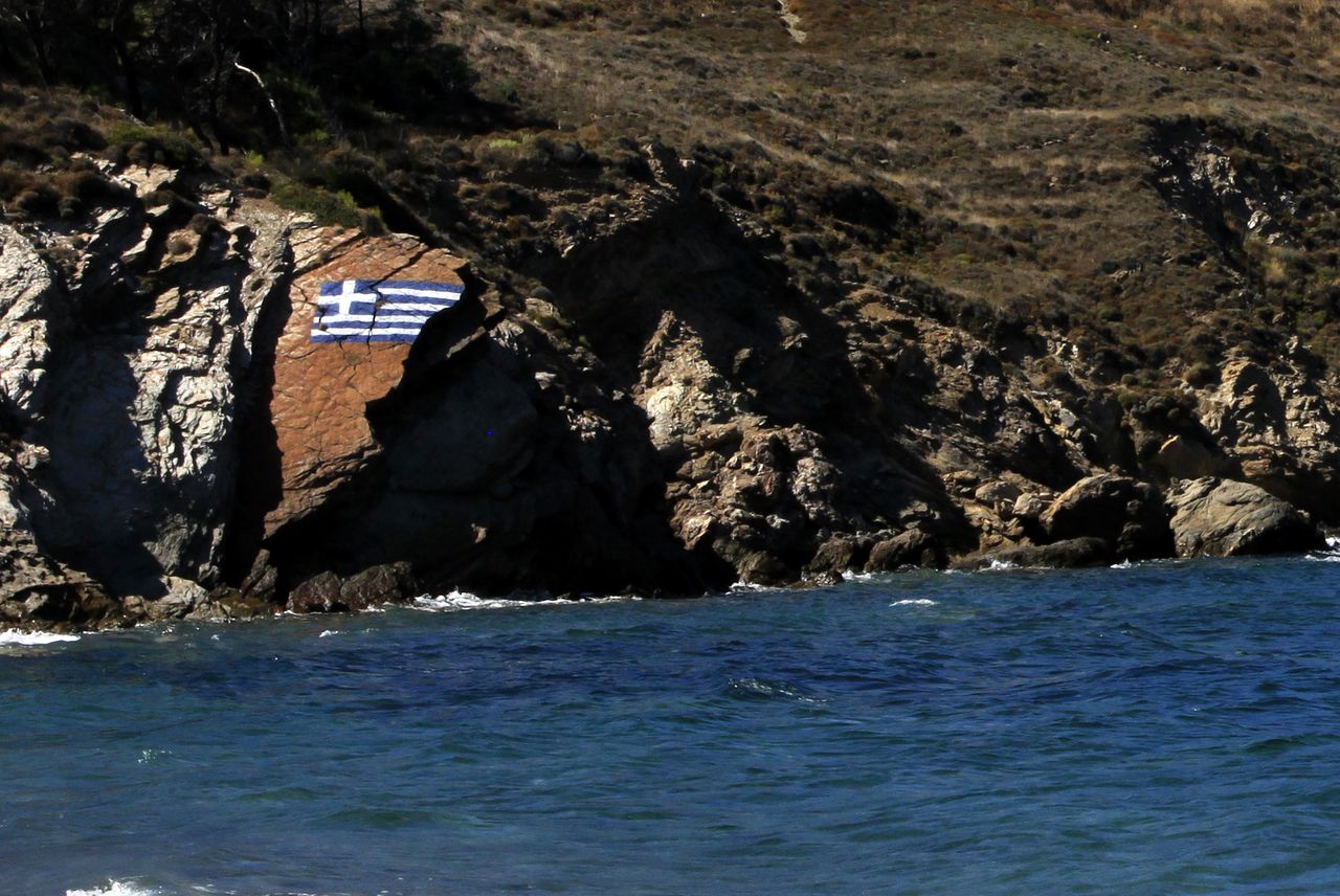 Greek flag on the rock