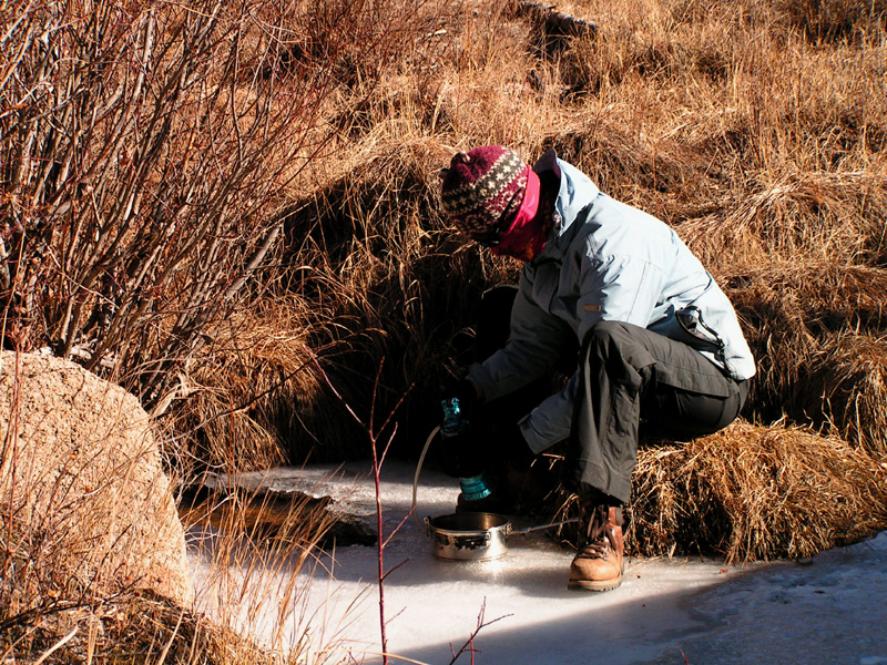 Mongolia - Paula filtering river water for drinking