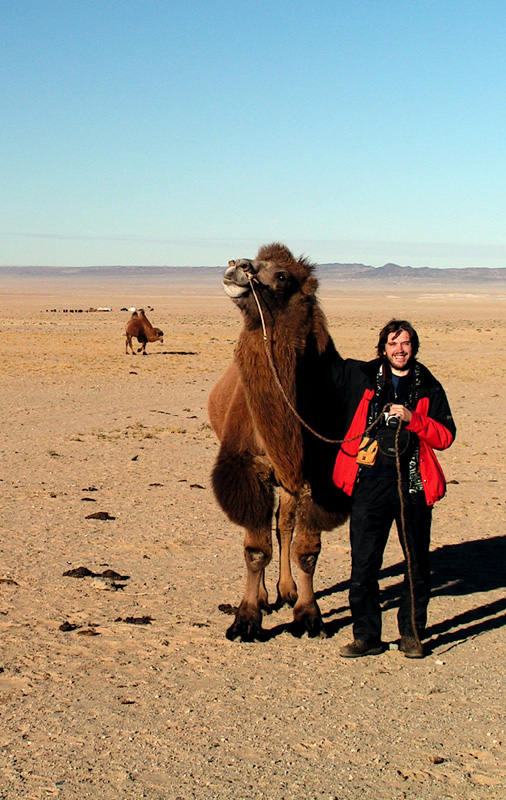 With a camel on the Gobi desert