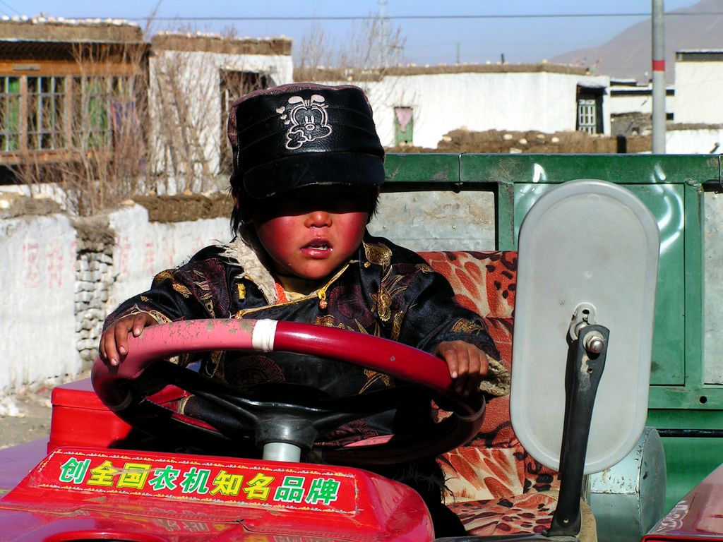 A small Tibetan boy playing