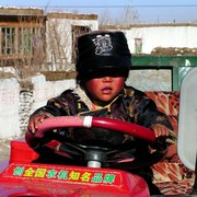 A small Tibetan boy playing