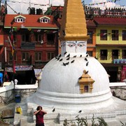 Brano prostrating in front of Boudhanath Stupa in Nepal
