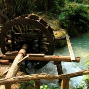 Laos - an old water mill in the Kouang Si waterfall