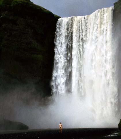 Iceland - a shower in Skogarfoss waterfall