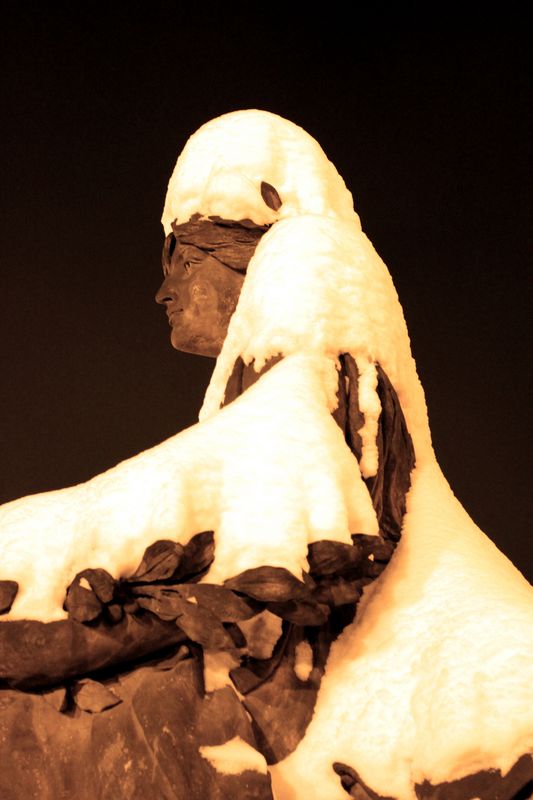 Czechia - Prague - a snowflaked statue in front of Rudolfinum