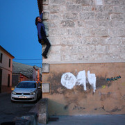 Mallorca - Lukas climbing the wall of an old house in Santa Margalida